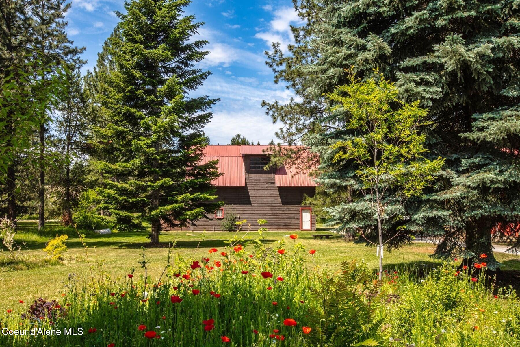 170 Flatwater Lane Sandpoint, ID 83864 - Photo 51 of 86 Barn and flower escape