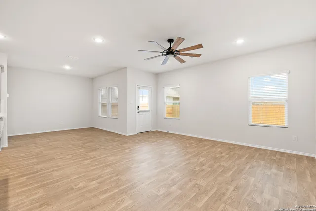 a view of kitchen with refrigerator a microwave and a stove