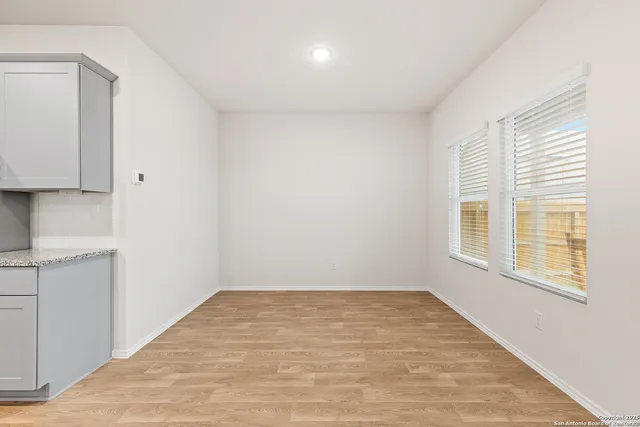 a view of kitchen with wooden floor