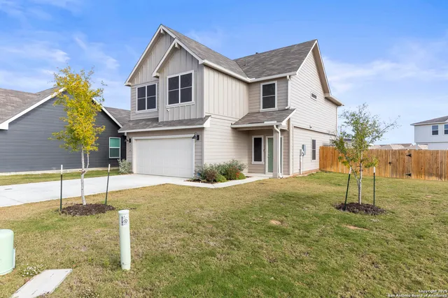 a view of a house with a small garden