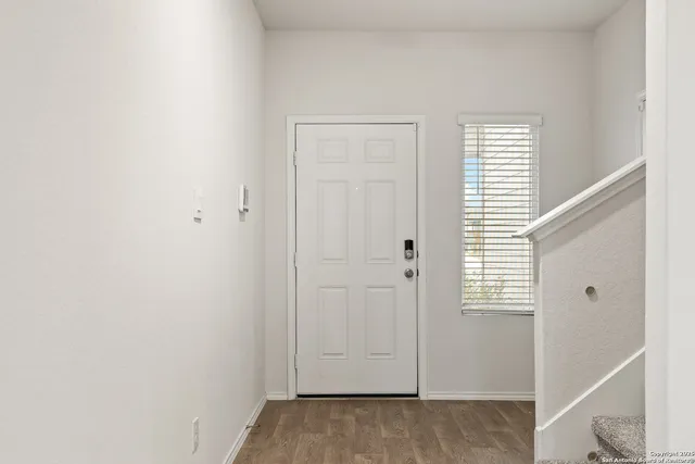 a kitchen with stainless steel appliances granite countertop a sink stove a refrigerator and cabinets