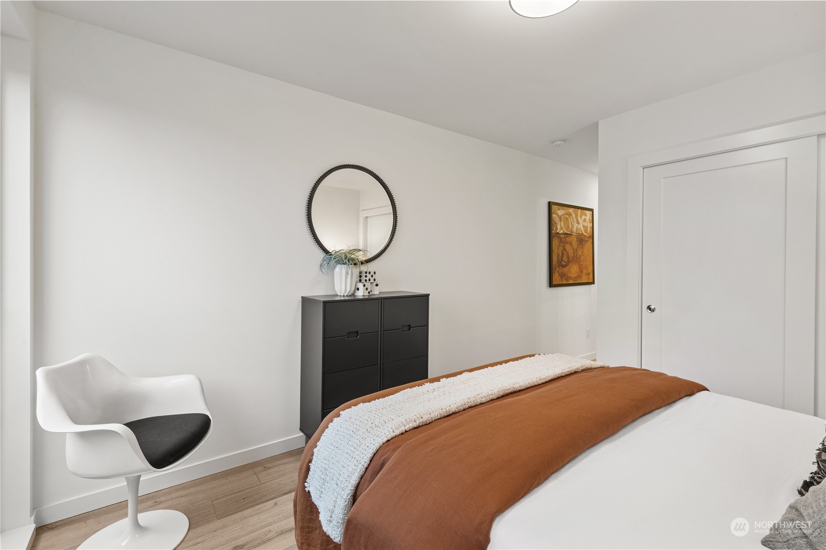 1425 East Howell Street Seattle, WA 98122 - Photo 16 of 20 a bedroom with a bed and a chair