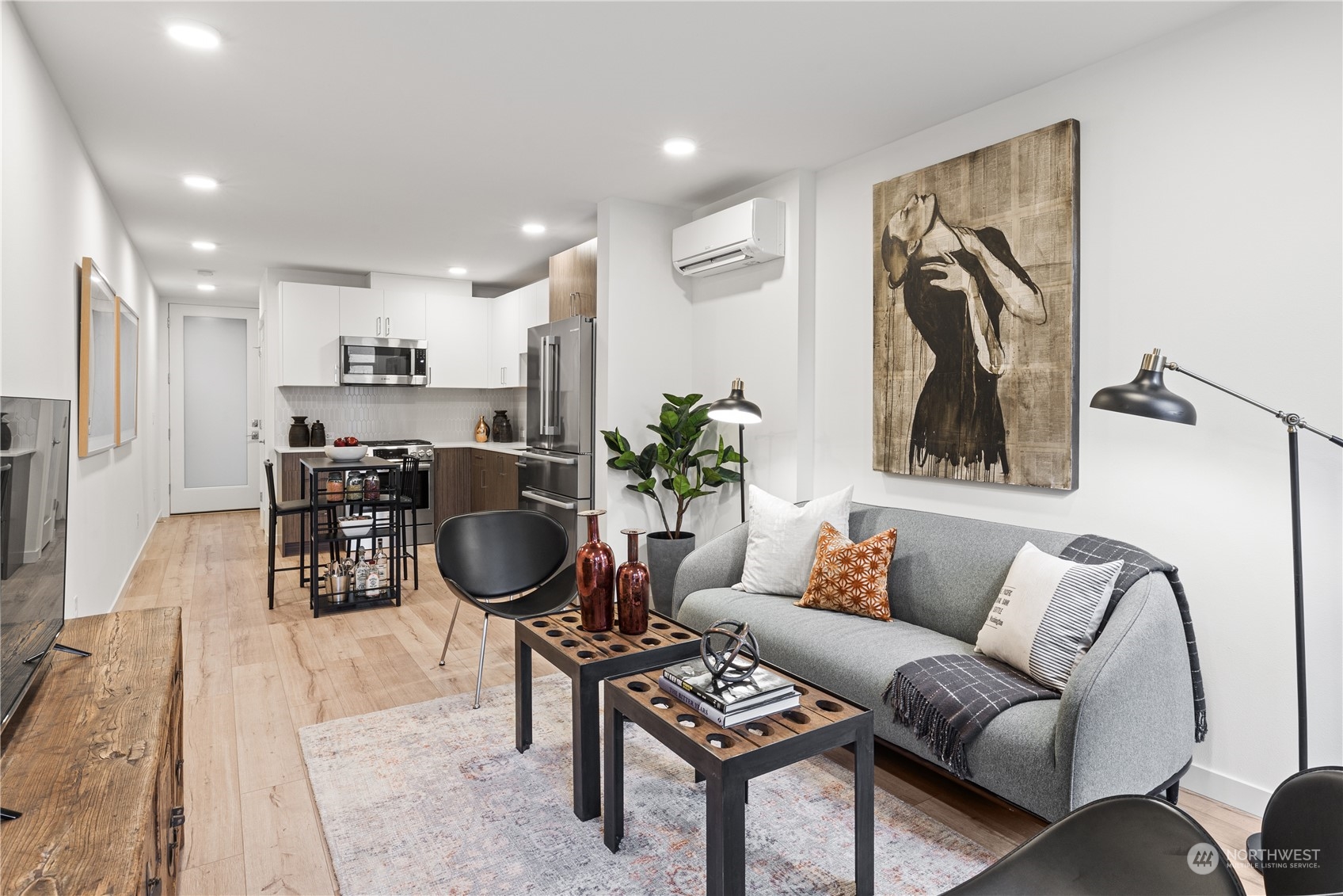 1425 East Howell Street Seattle, WA 98122 - Photo 2 of 20 a living room with furniture a dining table and kitchen view