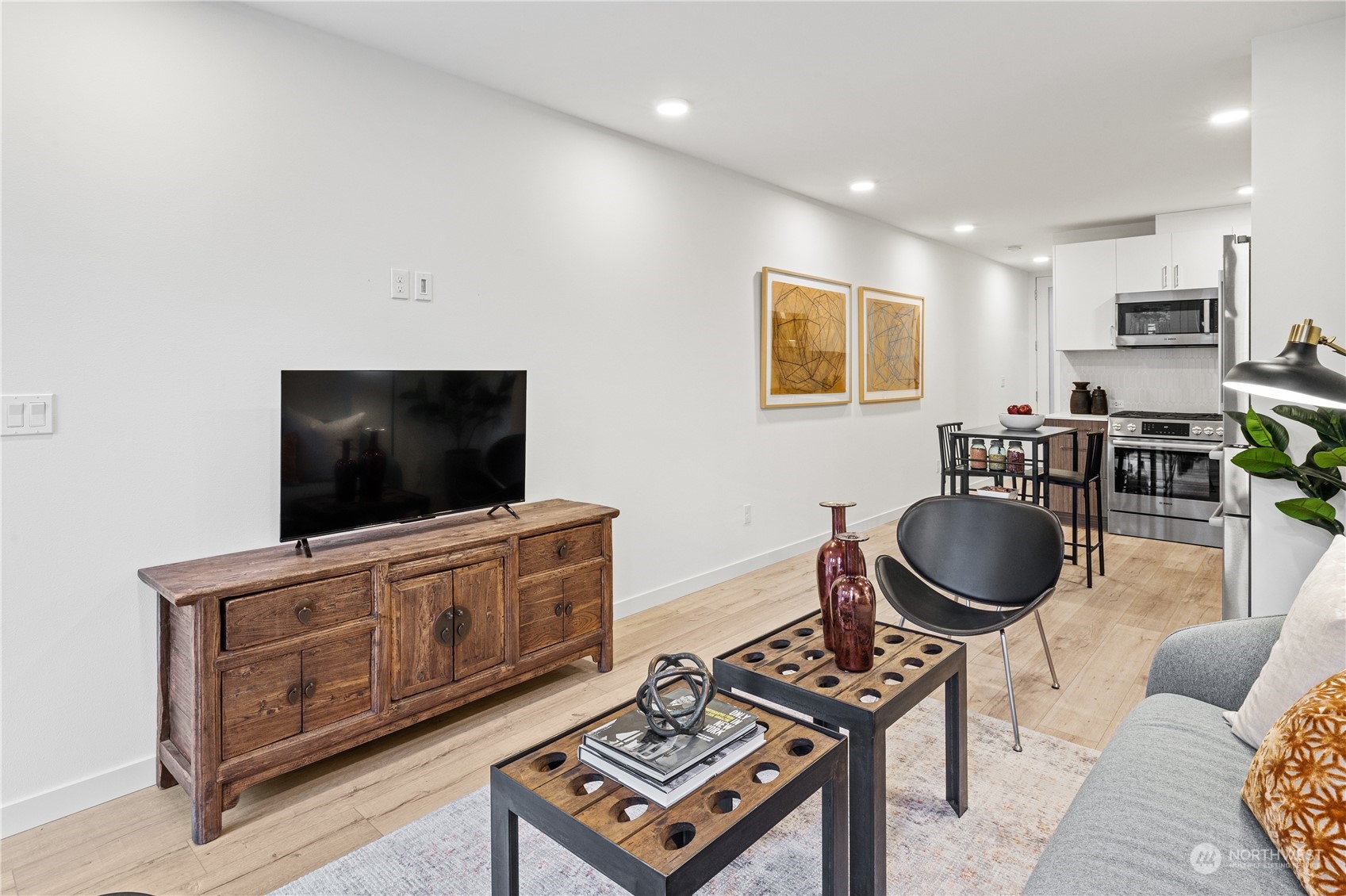 1425 East Howell Street Seattle, WA 98122 - Photo 3 of 20 a living room with furniture and a flat screen tv