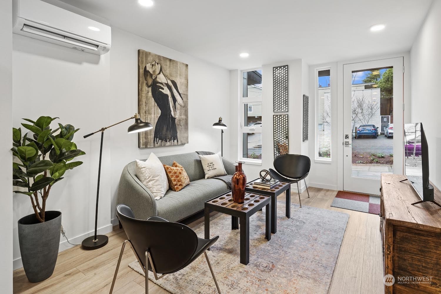 1425 East Howell Street Seattle, WA 98122 - Photo 4 of 20 a living room with furniture a rug and a potted plant