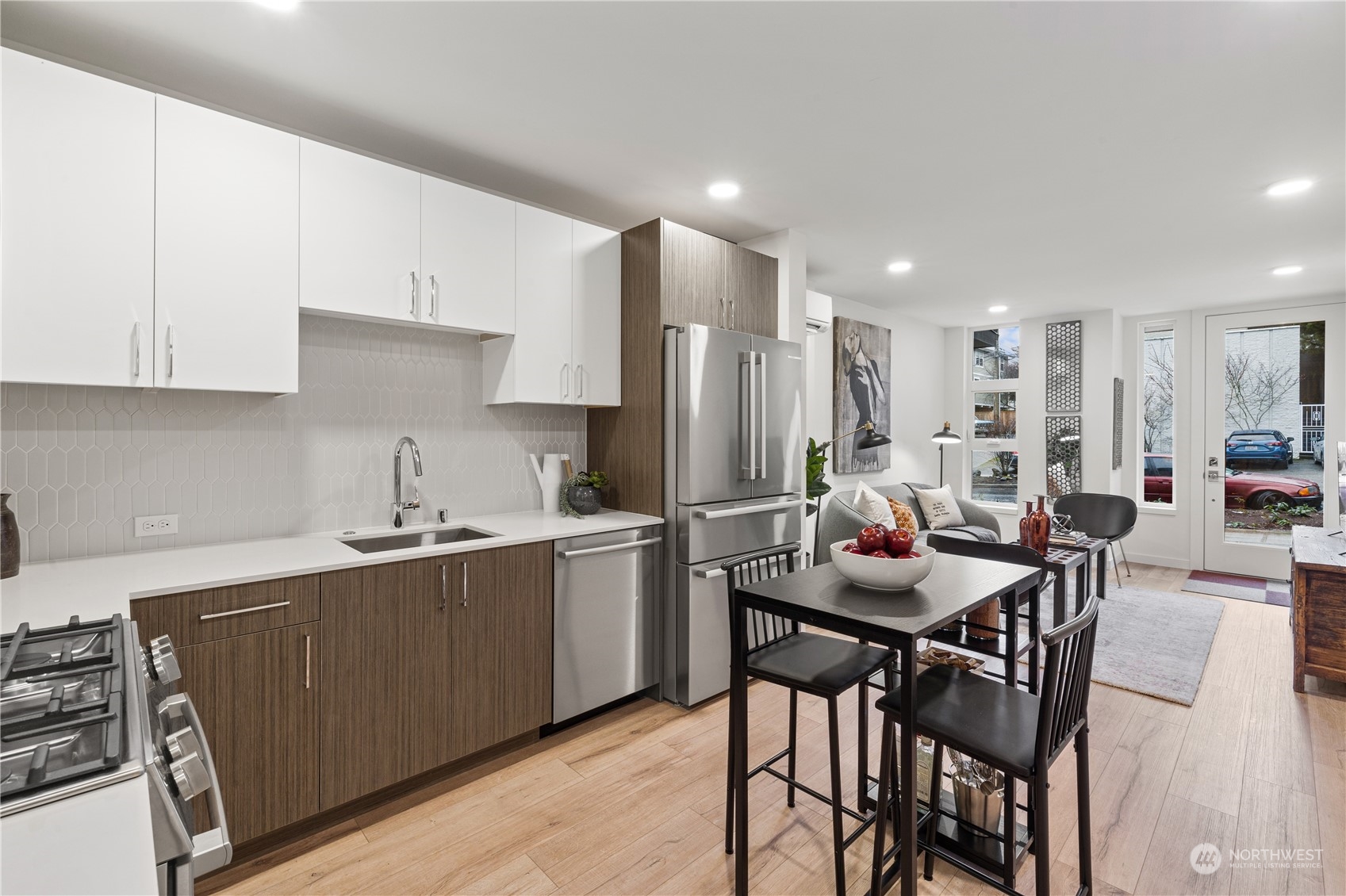 1425 East Howell Street Seattle, WA 98122 - Photo 8 of 20 a kitchen with a dining table chairs and refrigerator