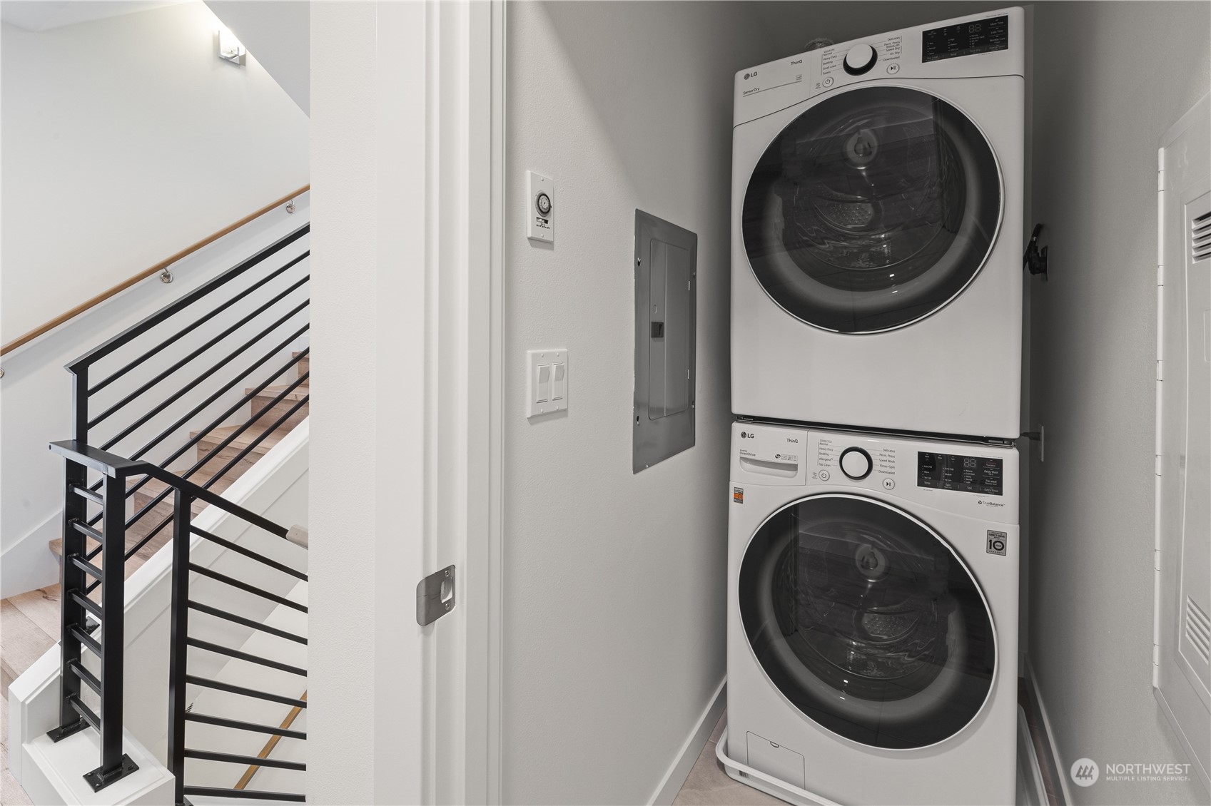 1425 East Howell Street Seattle, WA 98122 - Photo 9 of 20 a view of a hallway with washer and dryer