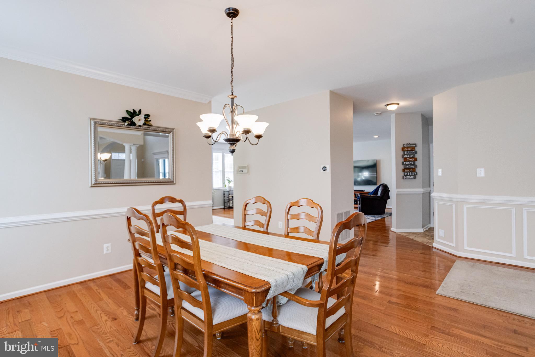 1705 Stone Ridge Court Bel Air, MD 21015 - Photo 17 of 81 a view of a dining room with furniture and wooden floor