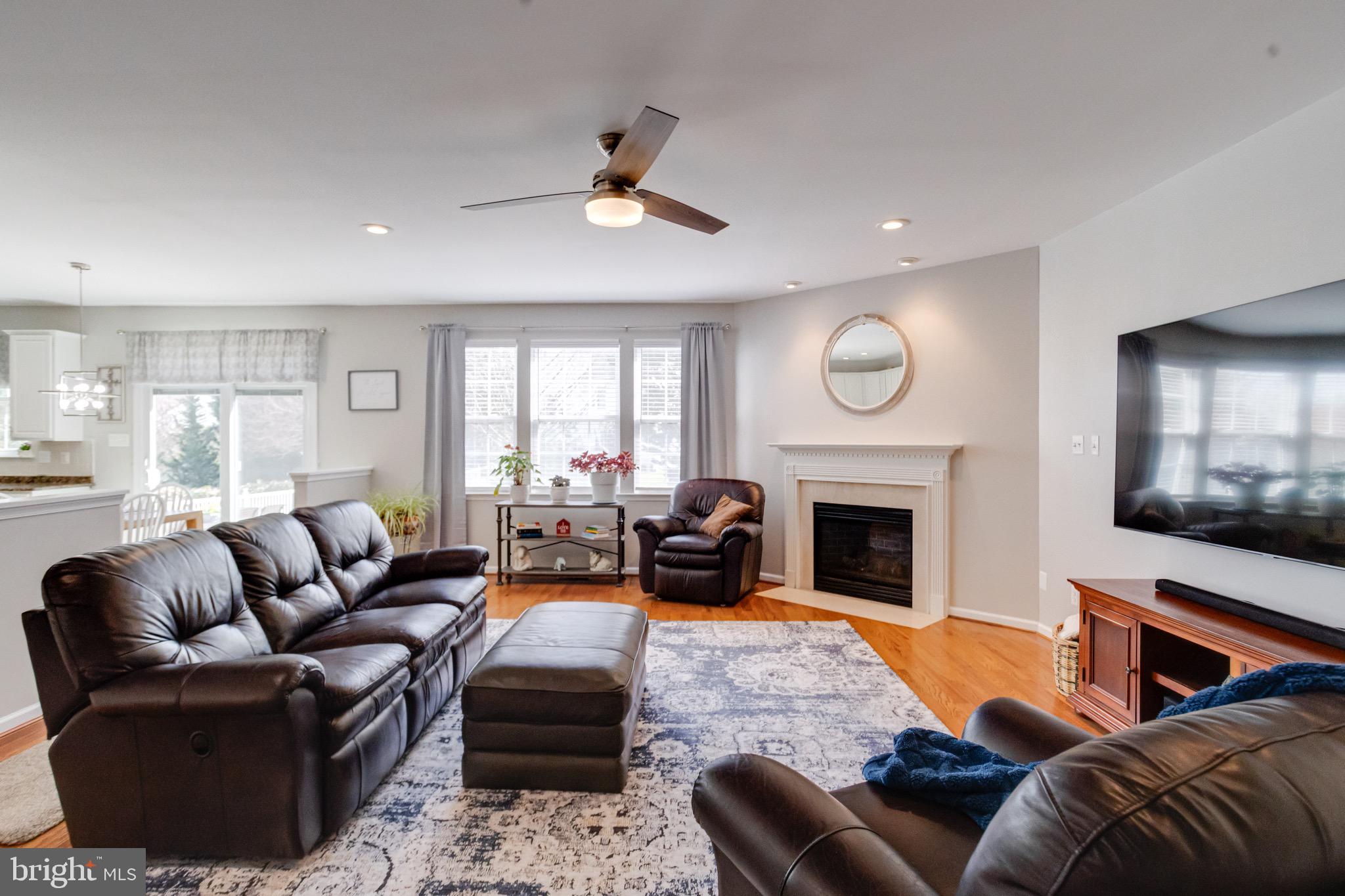 1705 Stone Ridge Court Bel Air, MD 21015 - Photo 21 of 81 a living room with furniture fireplace and flat screen tv