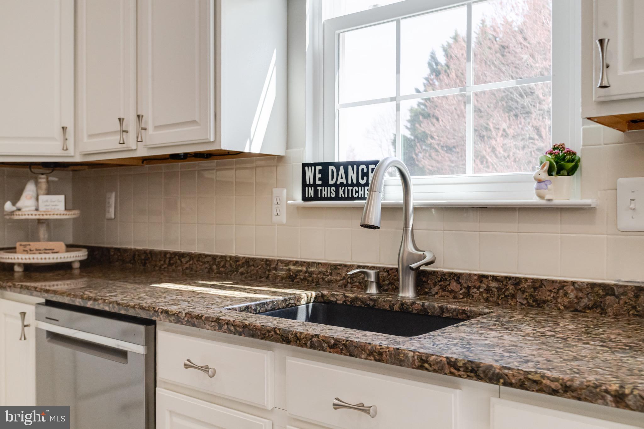 1705 Stone Ridge Court Bel Air, MD 21015 - Photo 33 of 81 a kitchen with granite countertop a sink and a window