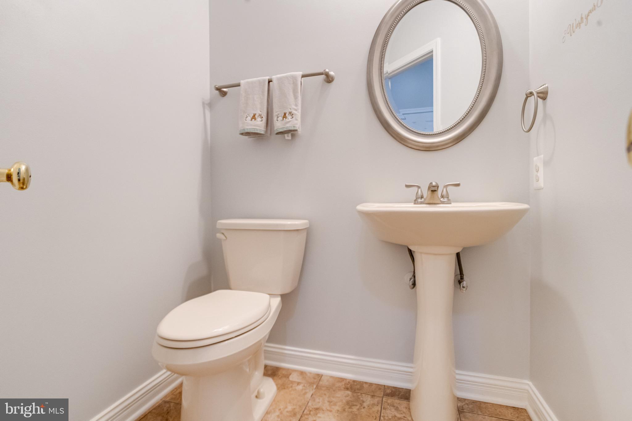 1705 Stone Ridge Court Bel Air, MD 21015 - Photo 35 of 81 a bathroom with a sink a mirror and a toilet