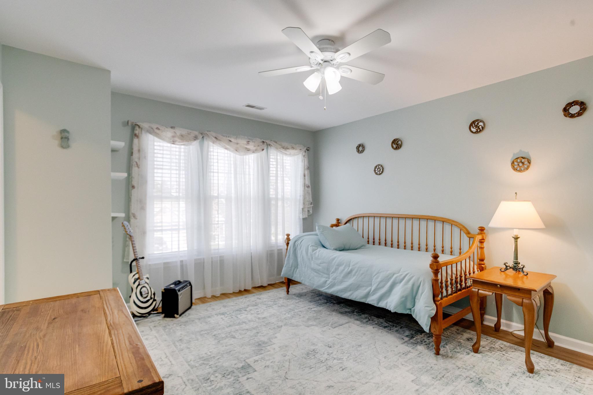 1705 Stone Ridge Court Bel Air, MD 21015 - Photo 38 of 81 a bedroom with a bed a lamp and a large window