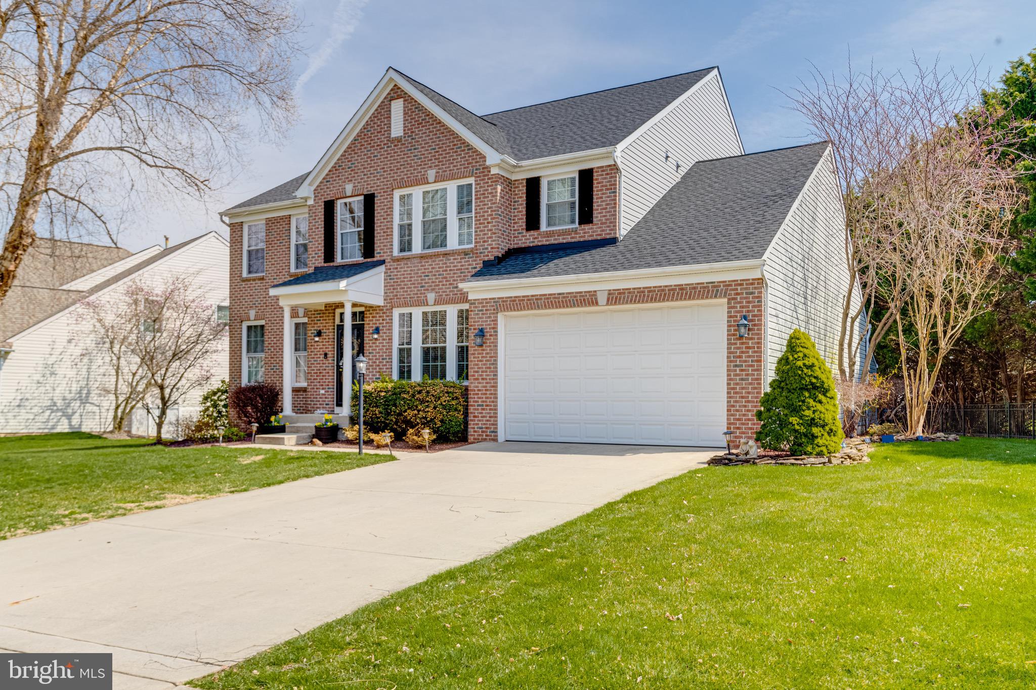 1705 Stone Ridge Court Bel Air, MD 21015 - Photo 4 of 81 a front view of a house with a yard and garage