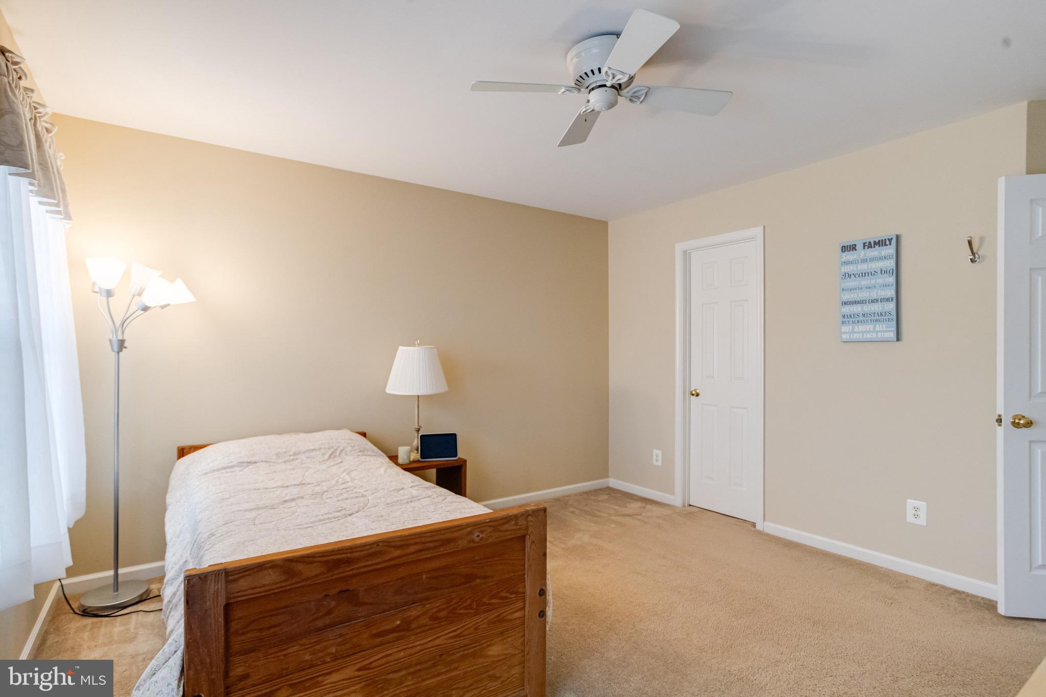 1705 Stone Ridge Court Bel Air, MD 21015 - Photo 45 of 81 a bedroom with a bed and a chandelier