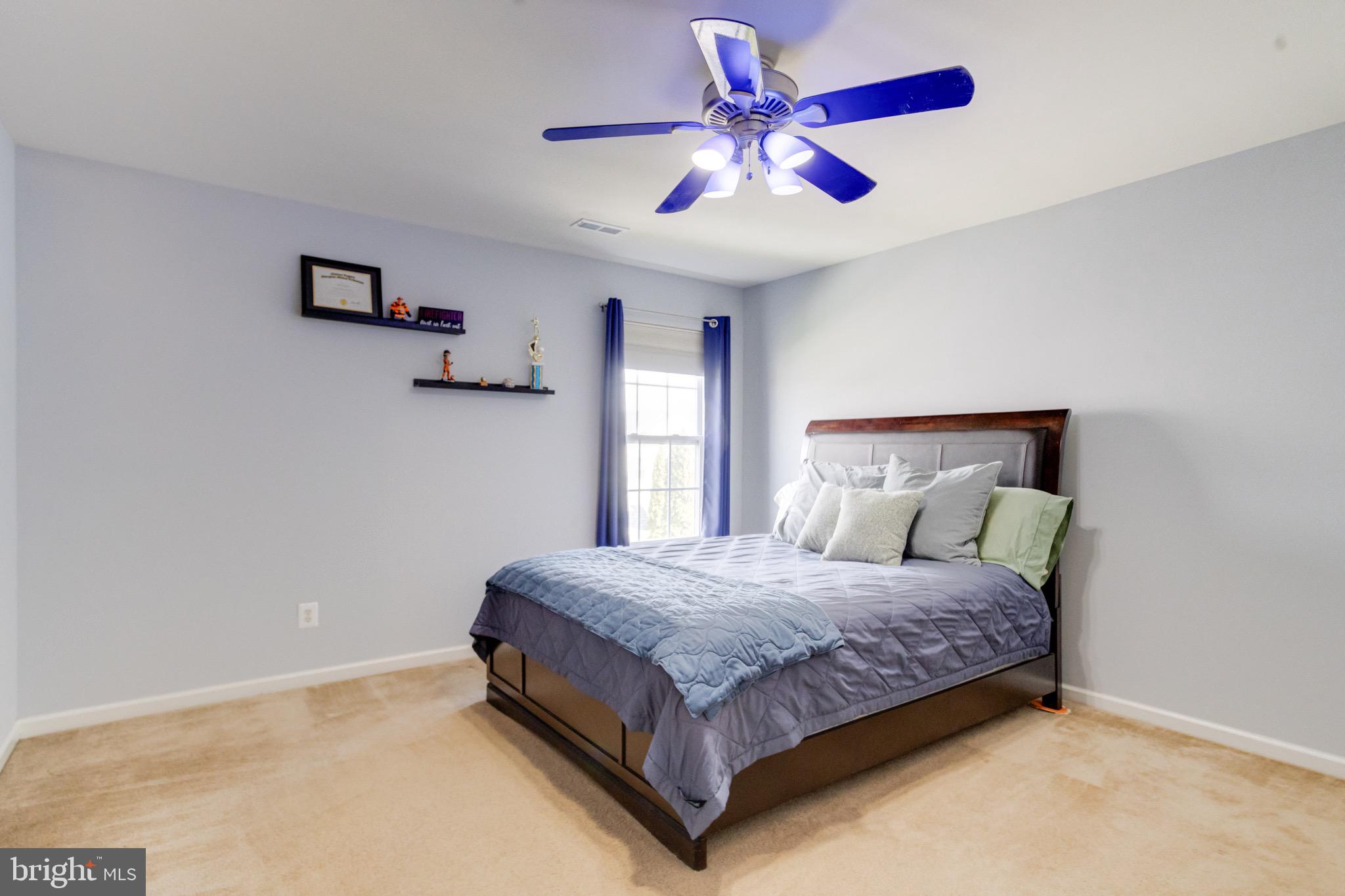 1705 Stone Ridge Court Bel Air, MD 21015 - Photo 46 of 81 a bedroom with a bed and a chandelier