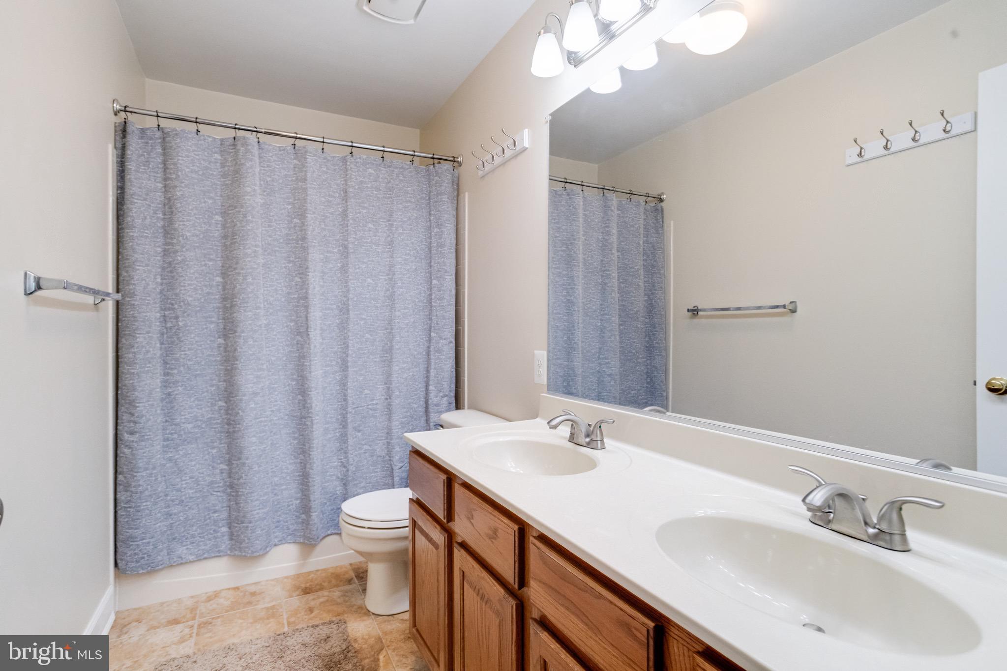 1705 Stone Ridge Court Bel Air, MD 21015 - Photo 49 of 81 a bathroom with a sink a toilet and shower