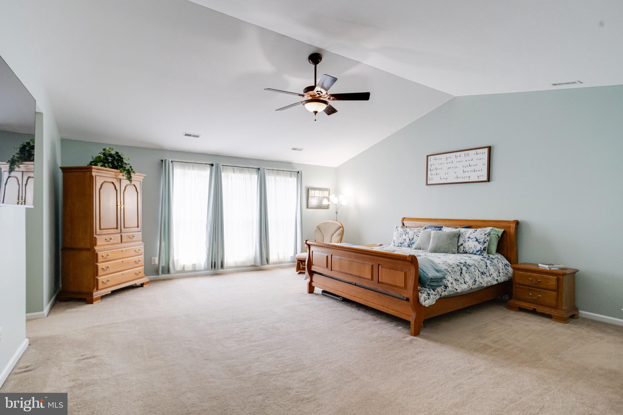 1705 Stone Ridge Court Bel Air, MD 21015 - Photo 50 of 81 a bedroom with a bed and a chandelier
