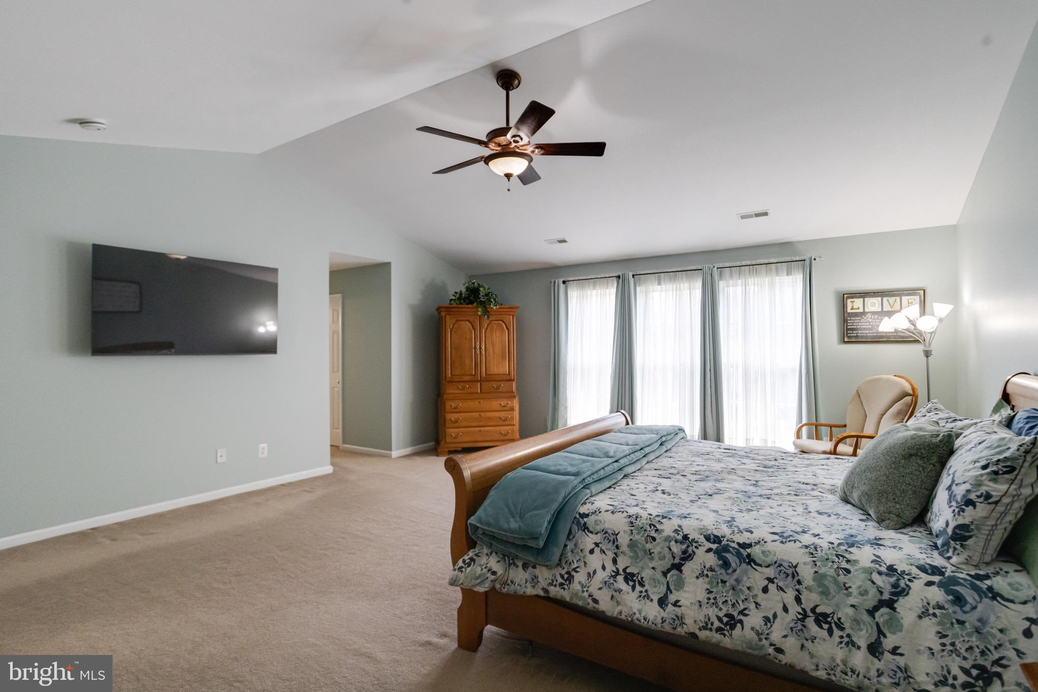 1705 Stone Ridge Court Bel Air, MD 21015 - Photo 52 of 81 a bedroom with a large bed and a flat screen tv