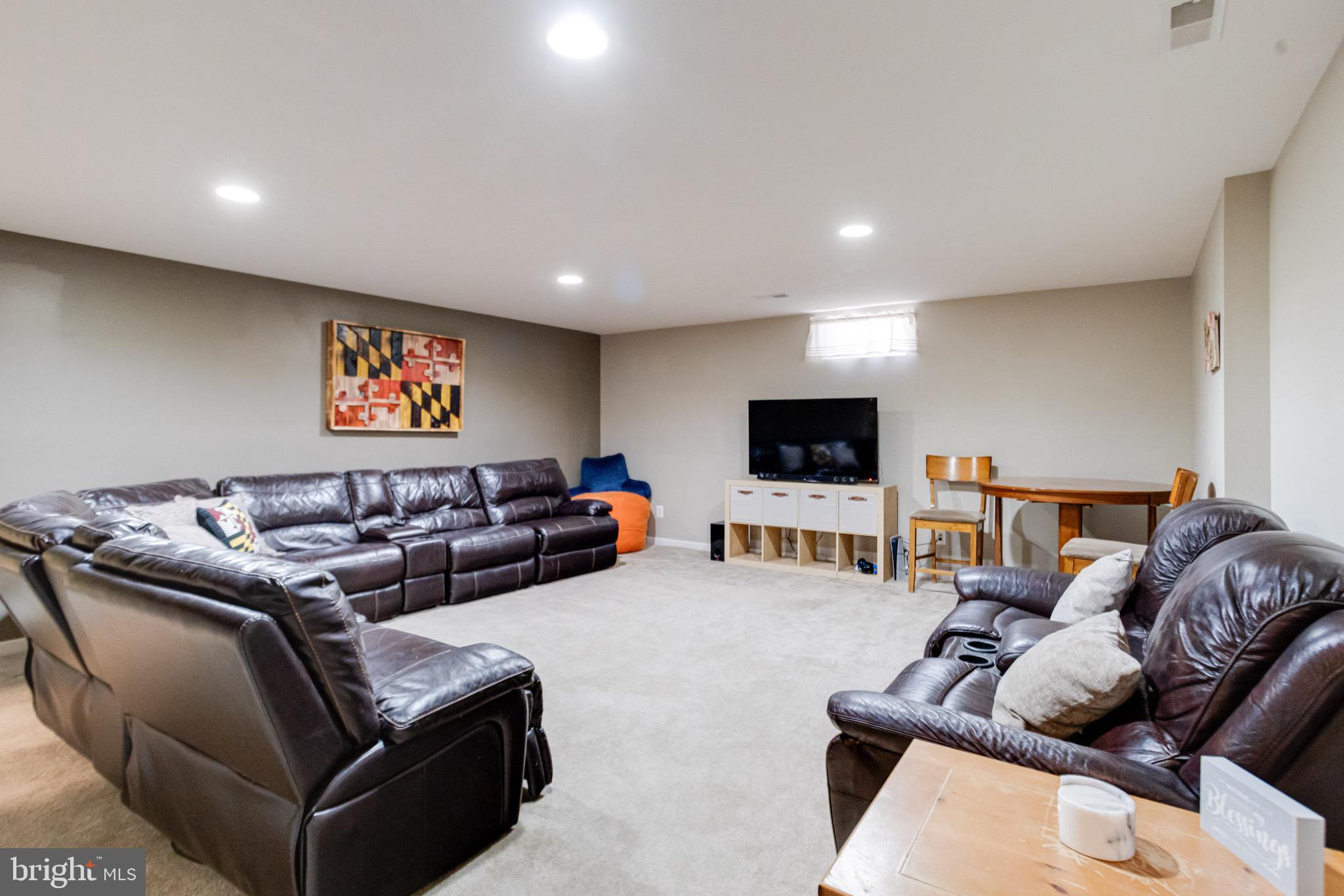 1705 Stone Ridge Court Bel Air, MD 21015 - Photo 59 of 81 a living room with furniture and a flat screen tv