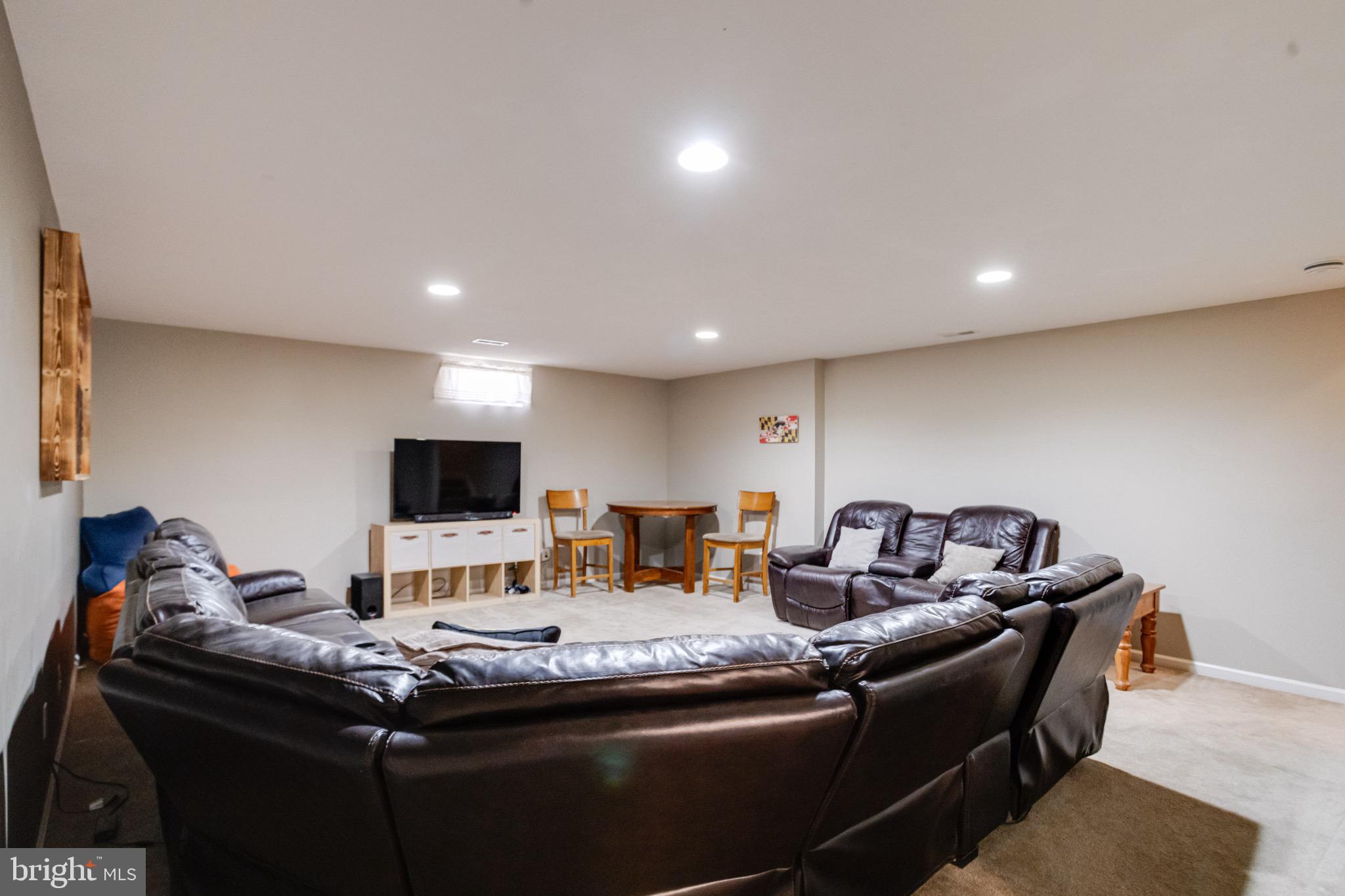 1705 Stone Ridge Court Bel Air, MD 21015 - Photo 61 of 81 a living room with furniture and a flat screen tv