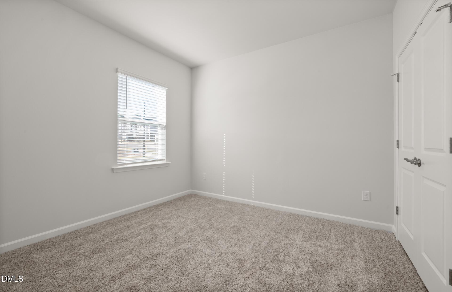 918 Fearless Road Durham, NC 27703 - Photo 19 of 25 an empty room with windows