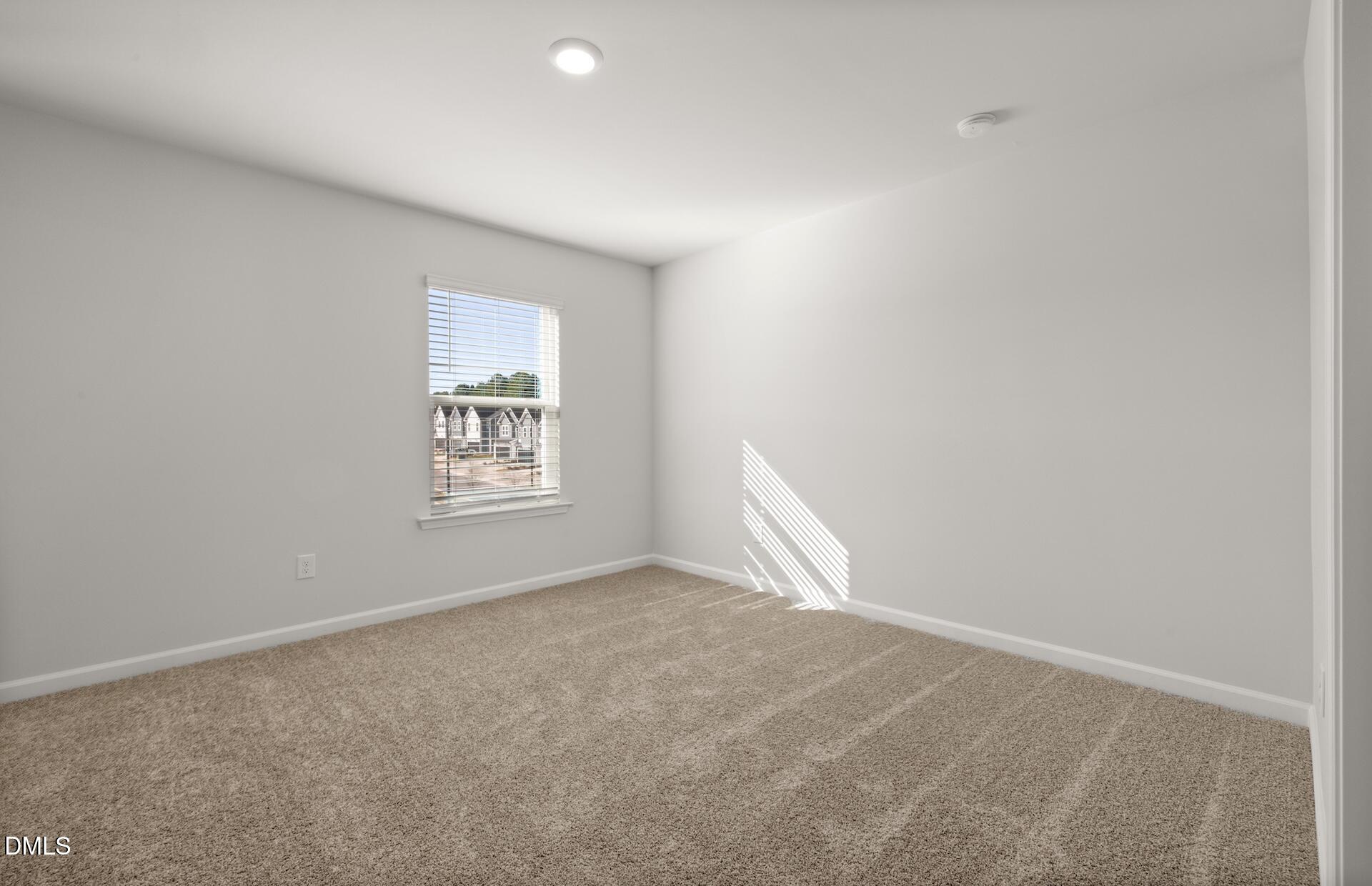 918 Fearless Road Durham, NC 27703 - Photo 21 of 25 an empty room with a window