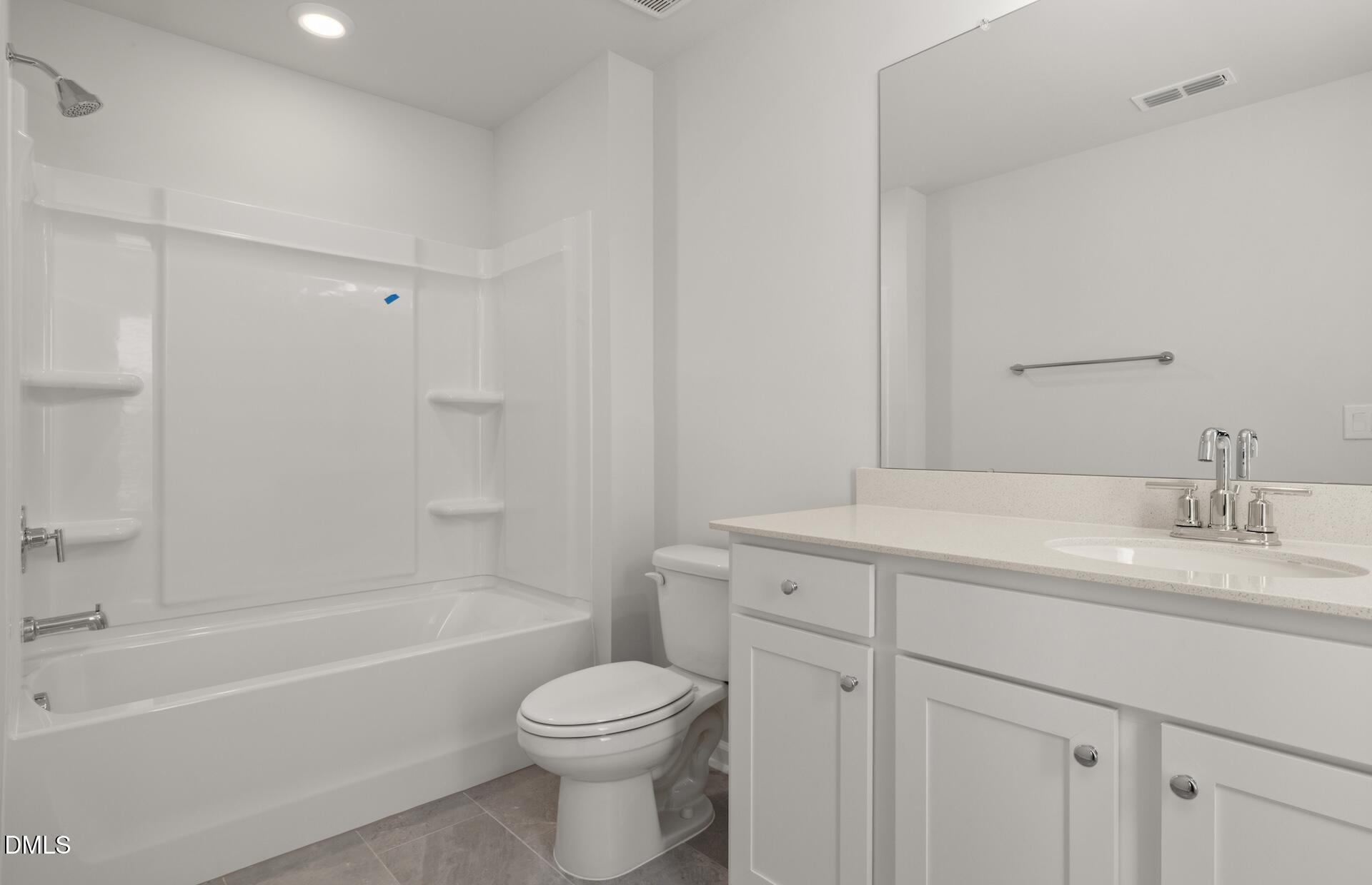 918 Fearless Road Durham, NC 27703 - Photo 22 of 25 a bathroom with a sink a toilet and a bathtub