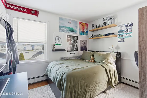 a bedroom with bed and window