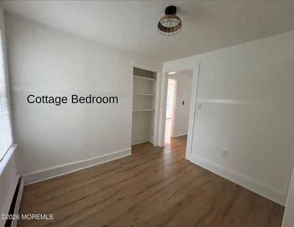 an empty room with wooden floor