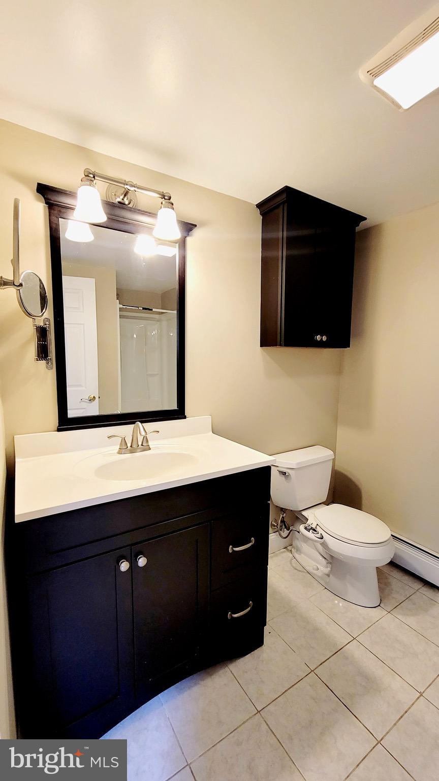 1575 West Street Road, Unit 832 Warminster, PA 18974 - Photo 11 of 14 a bathroom with a toilet sink and mirror
