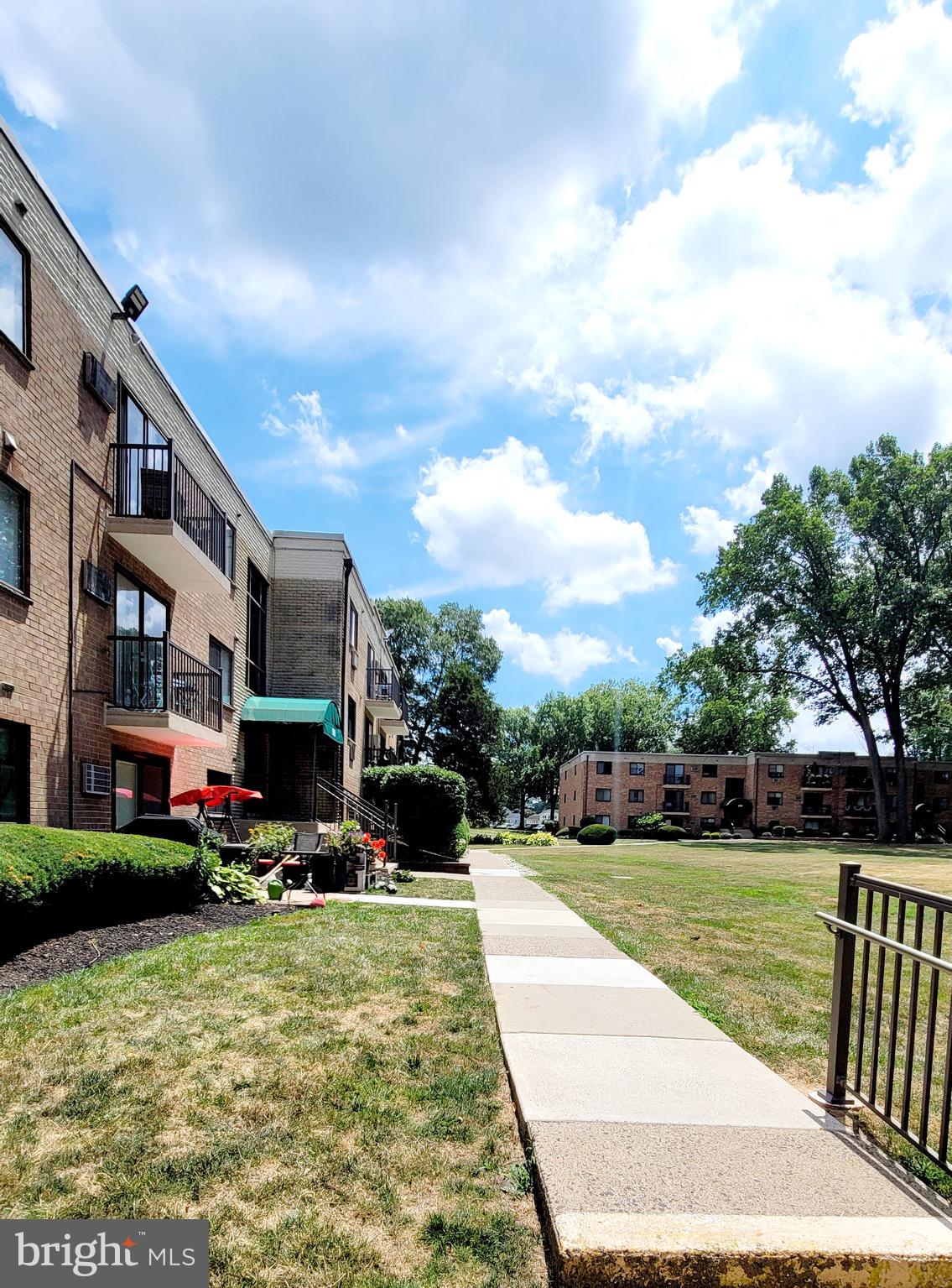 1575 West Street Road, Unit 832 Warminster, PA 18974 - Photo 14 of 14 a view of swimming pool with outdoor seating and a pathway