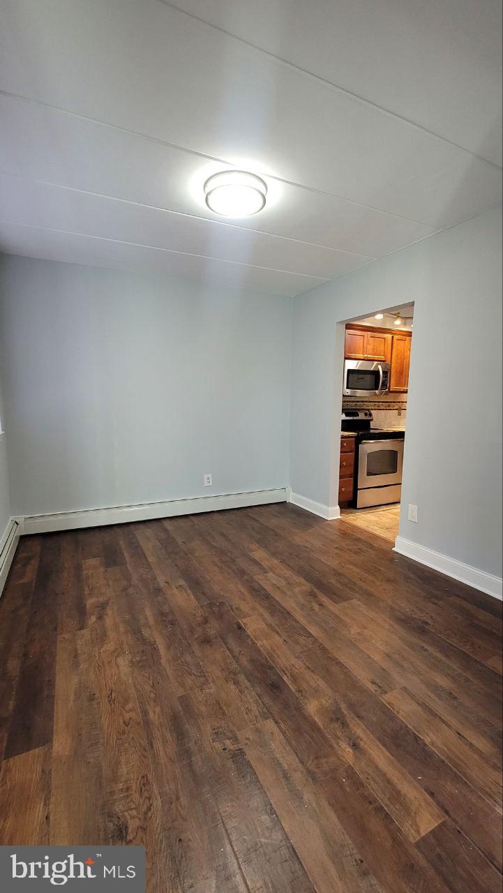 1575 West Street Road, Unit 832 Warminster, PA 18974 - Photo 6 of 14 a view of empty room with wooden floor