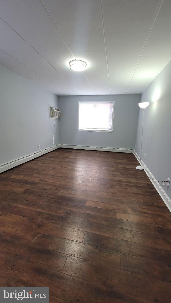 1575 West Street Road, Unit 832 Warminster, PA 18974 - Photo 7 of 14 an empty room with wooden floor and windows