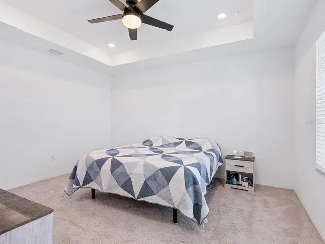 a bedroom with a bed and a dresser