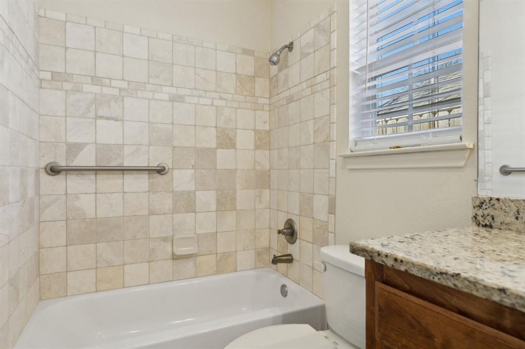 233 Firefly Drive Springtown, TX 76082 - Photo 8 of 16 Bathroom featuring a tub/shower combination with a built-in grab bar