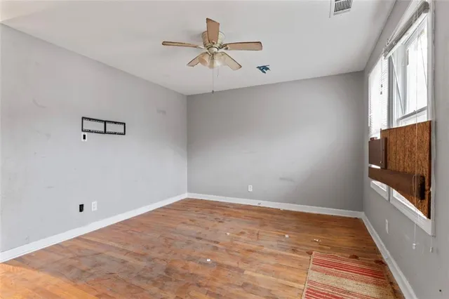 a view of room with window and ceiling fan