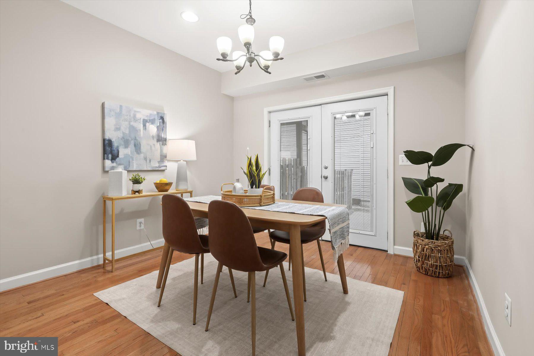 1749 South Hanover Street Baltimore, MD 21230 - Photo 13 of 55 a view of a dining room with furniture and wooden floor