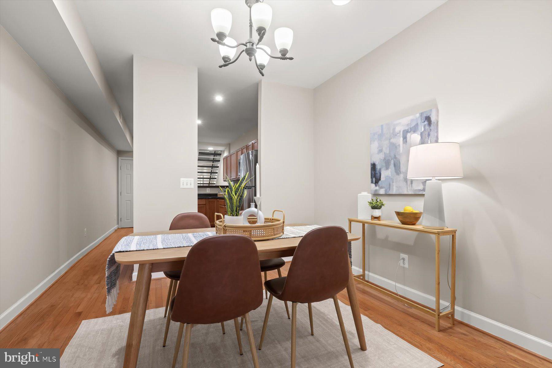 1749 South Hanover Street Baltimore, MD 21230 - Photo 14 of 55 a view of a dining room with furniture and wooden floor