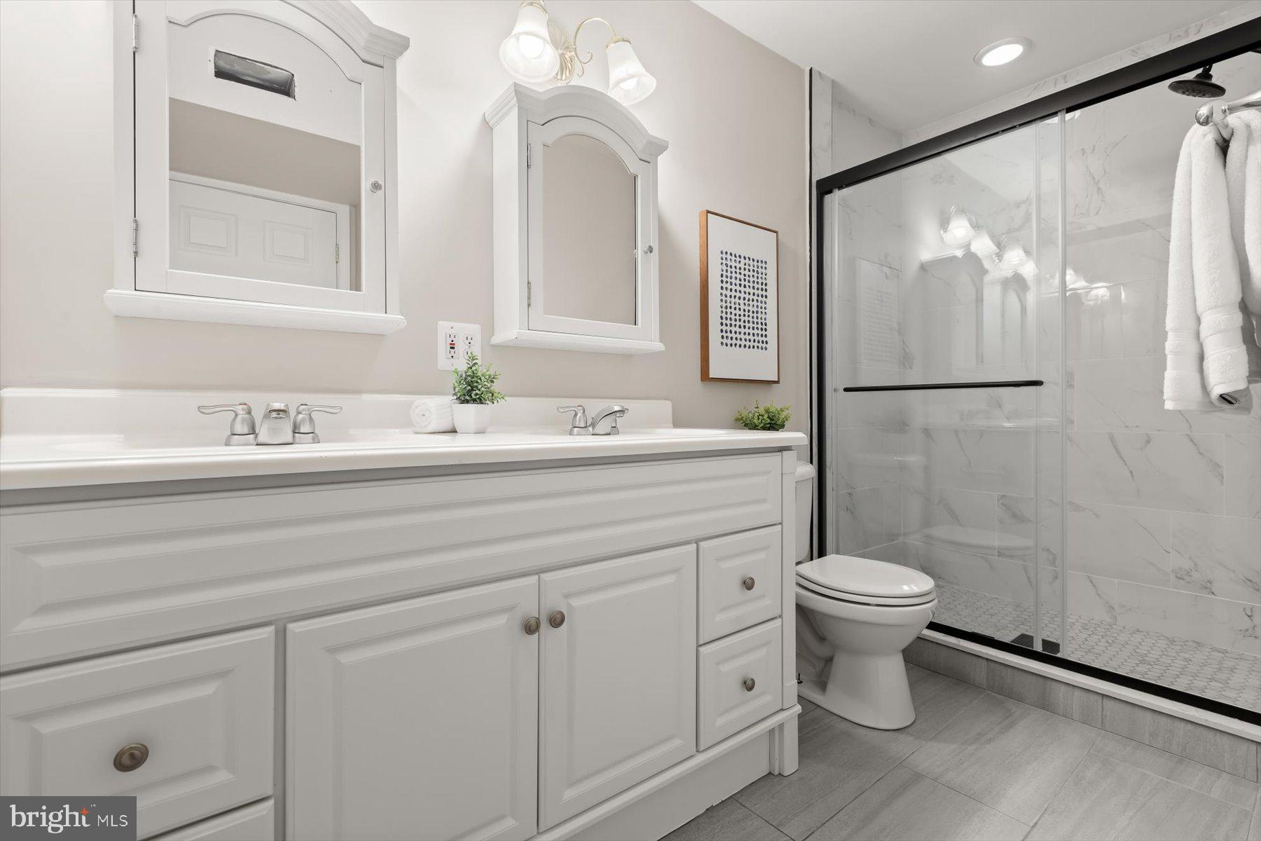 1749 South Hanover Street Baltimore, MD 21230 - Photo 20 of 55 a bathroom with a sink toilet and shower