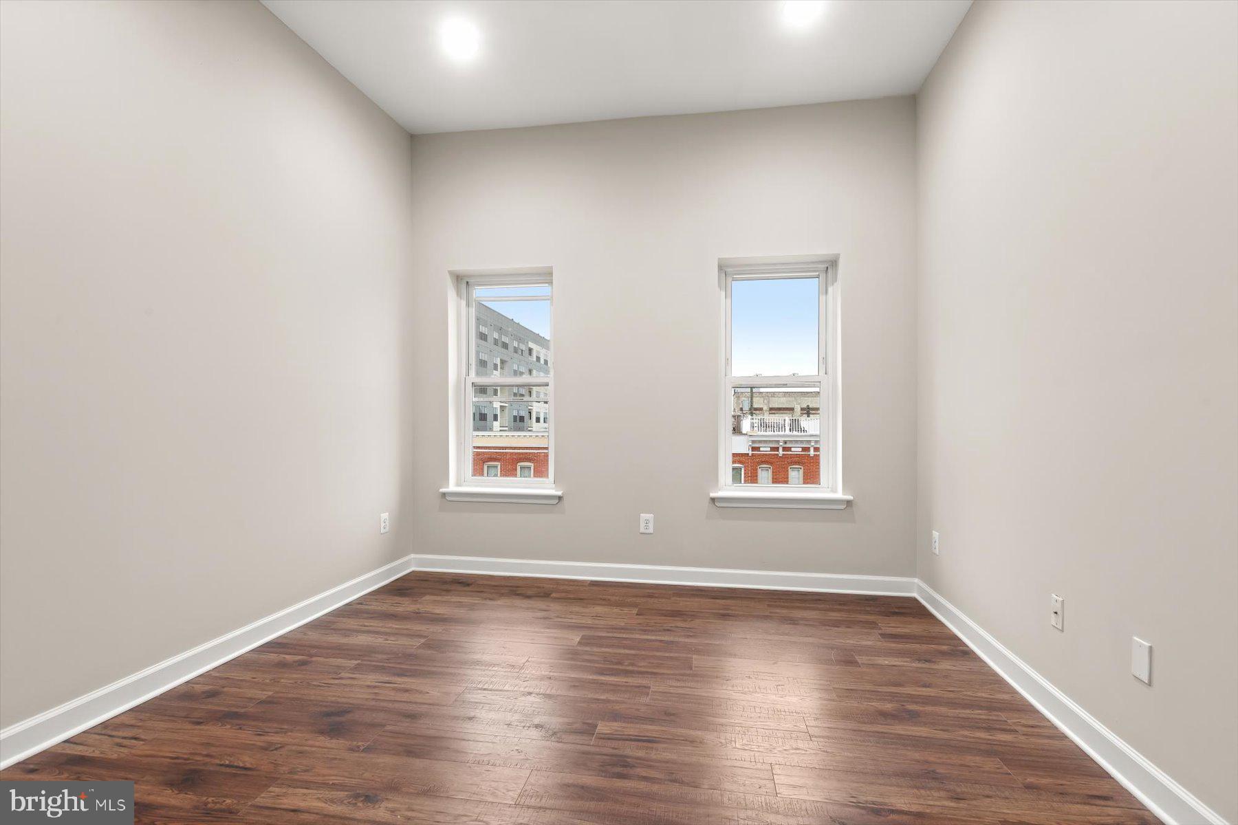 1749 South Hanover Street Baltimore, MD 21230 - Photo 22 of 55 an empty room with wooden floor and window