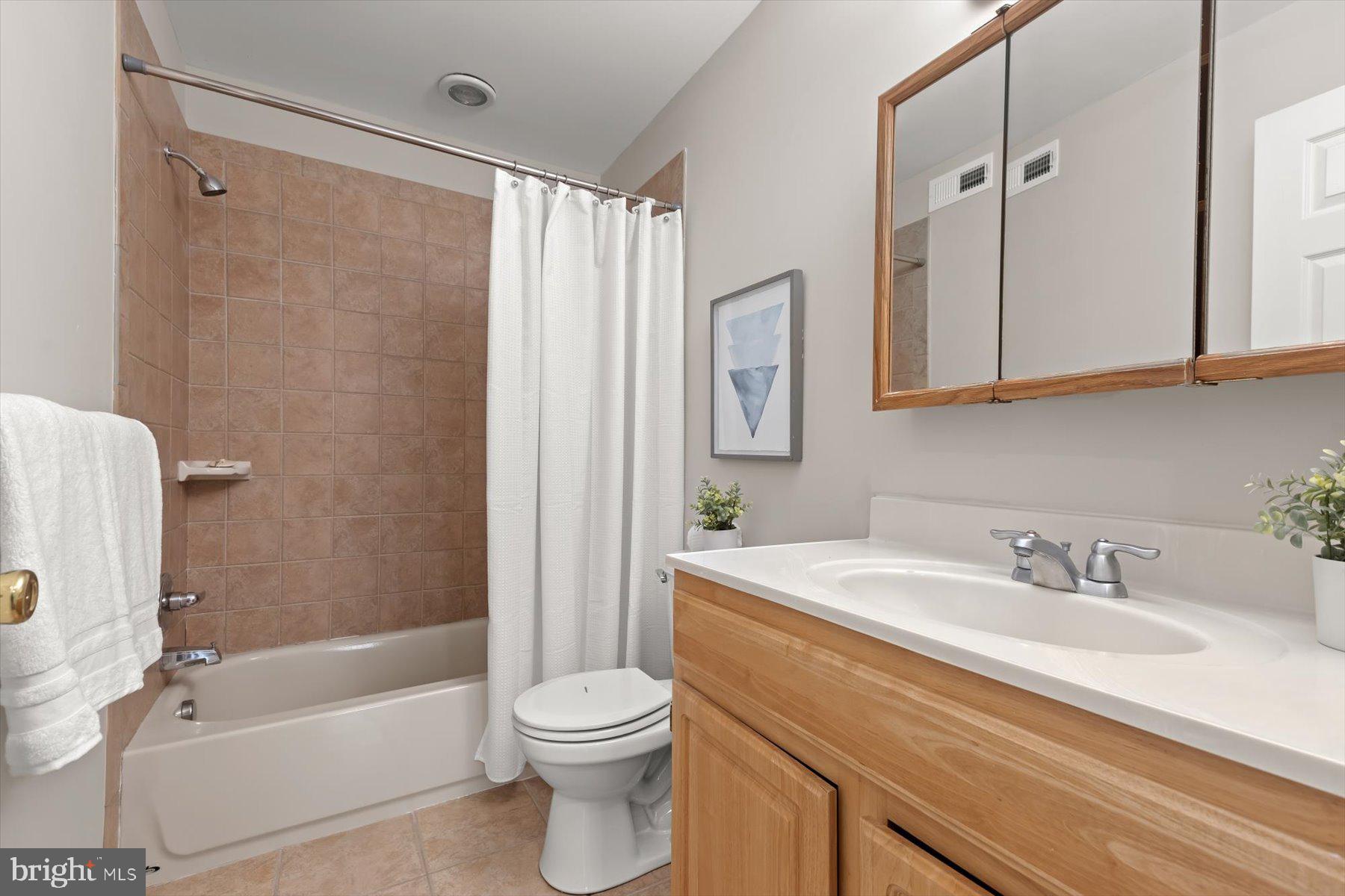 1749 South Hanover Street Baltimore, MD 21230 - Photo 24 of 55 a bathroom with a sink a toilet and shower