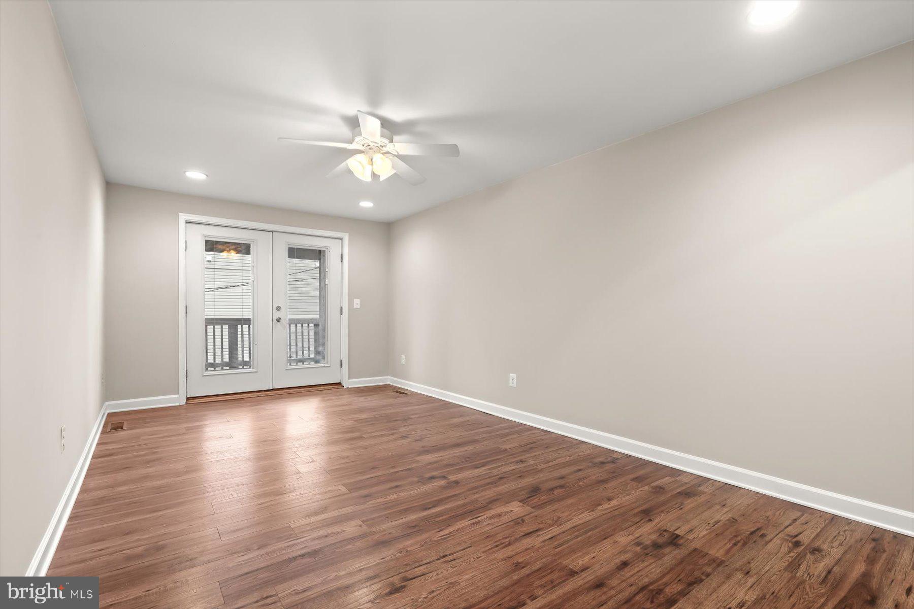 1749 South Hanover Street Baltimore, MD 21230 - Photo 26 of 55 wooden floor in an empty room with a window
