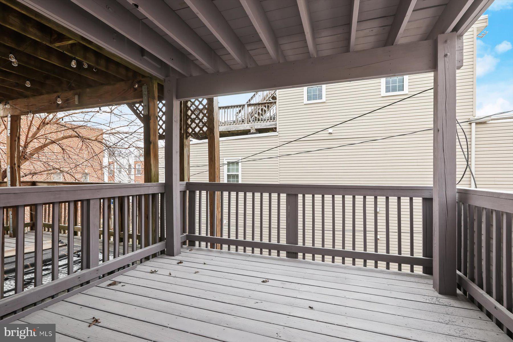 1749 South Hanover Street Baltimore, MD 21230 - Photo 28 of 55 a view of balcony with wooden floor