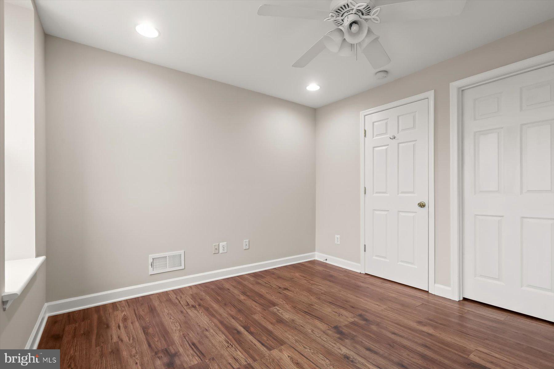 1749 South Hanover Street Baltimore, MD 21230 - Photo 33 of 55 a view of an empty room with wooden floor and a window