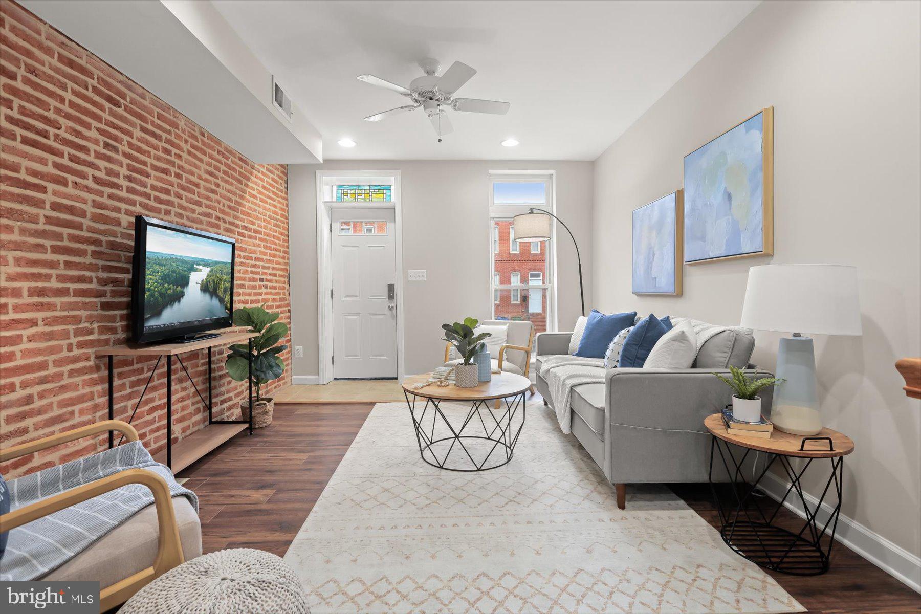 1749 South Hanover Street Baltimore, MD 21230 - Photo 5 of 55 a living room with furniture and a flat screen tv