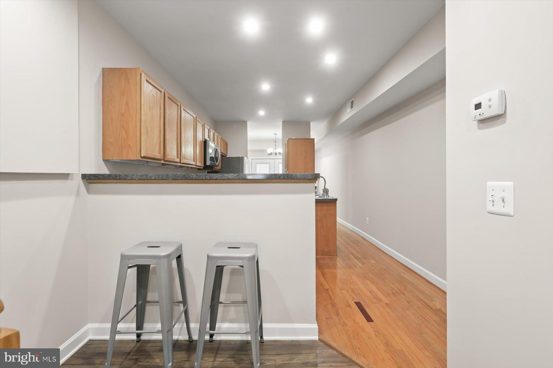 1749 South Hanover Street Baltimore, MD 21230 - Photo 8 of 55 a view of kitchen with stainless steel appliances granite countertop cabinets and a dining table