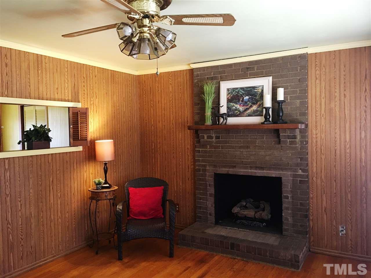202 Lancaster Road Mebane, NC 27302 - Photo 3 of 9 a living room with furniture and a fireplace