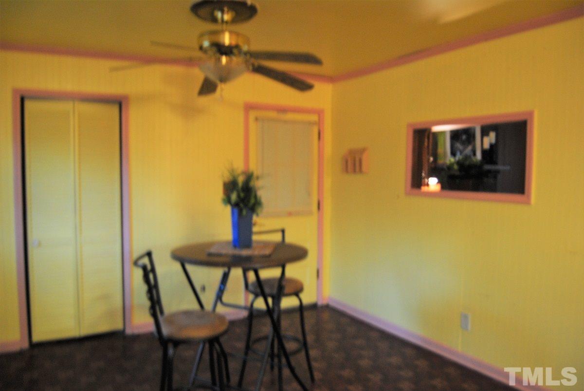 202 Lancaster Road Mebane, NC 27302 - Photo 6 of 9 a view of a room with a table and chairs