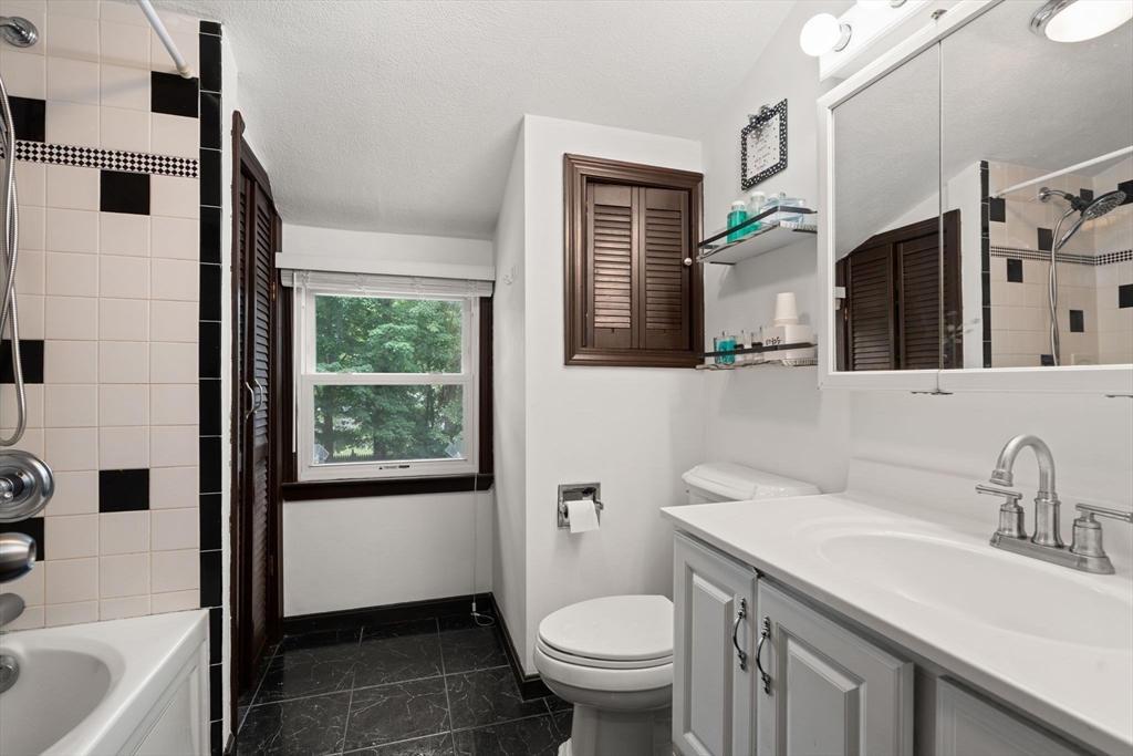 9 Laurel Lane Bellingham, MA 02019 - Photo 26 of 30 a bathroom with a sink toilet and shower