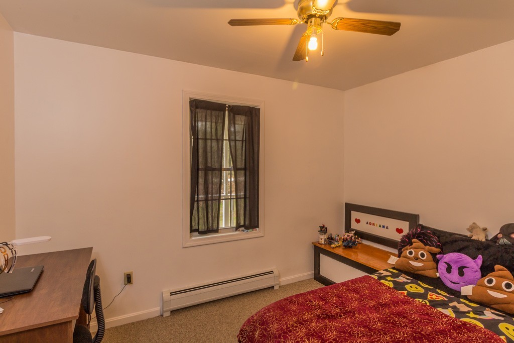 5294 South Athol Road Athol, MA 01331 - Photo 7 of 13 a bedroom with a bed and a window